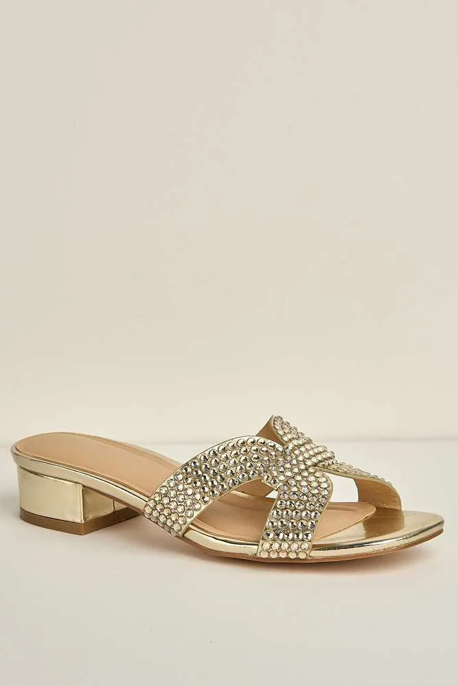 Della Gemstone Embellished Slip On Block Heel Mules in Gold